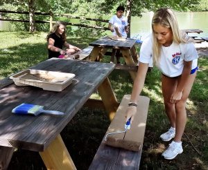 MHS club paints picnic tables ahead of Star City farmers market opening